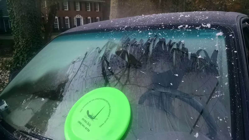mrmister frisbee being used to scrape ice.