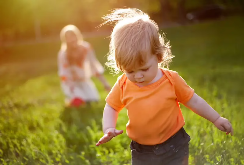 child playing in a field
