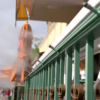 automated misting system on metal fencing in front of a building