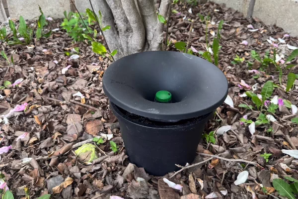 Photo of a Georgia residents backyard In2Care installation placed amongst a pile of leaves.